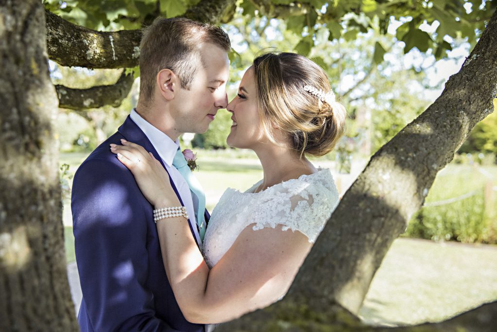 We are very lucky as wedding photographers that we are almost certain to be surrounded by beautiful things. I really try to use my environment to make a good picture even better. This lovely shot of Grace and Rory under a tree was taken as the sun was slowly setting and it really frames them and shows how relaxed they are. The champagne also helped........