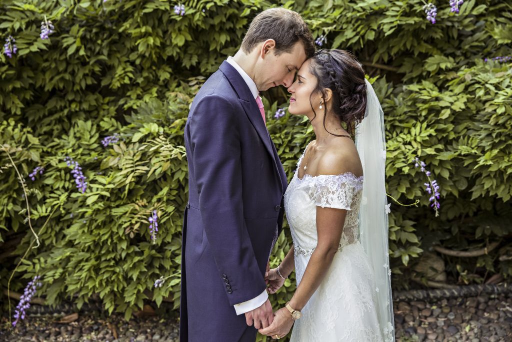 bride and groom heads together cambridge wedding