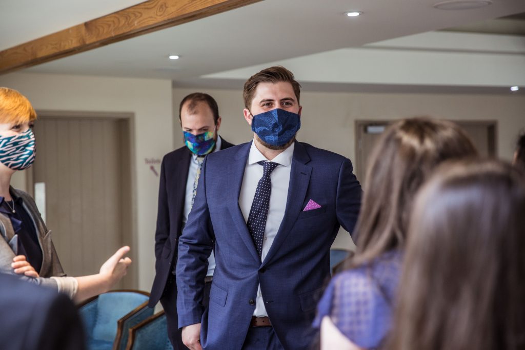 groom in face mask, brideCambridgeshire wedding photographer, covid wedding, Red Lion Whittlesford, Reportage wedding photographer