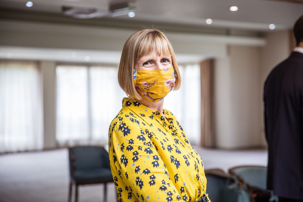 guest in face mask, bride Cambridgeshire wedding photographer, covid wedding, Red Lion Whittlesford, Reportage wedding photographer