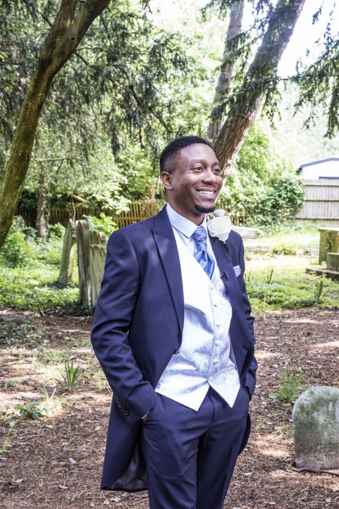 a groom at the church london wedding photography