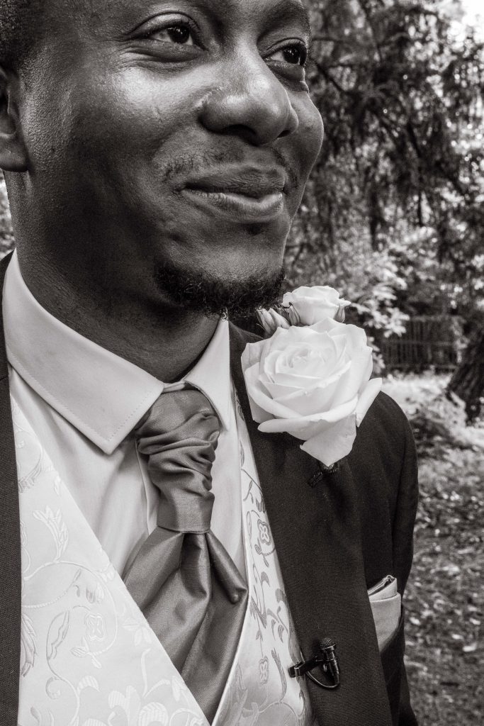 close up of groom, flower, pinhole, london wedding photographer