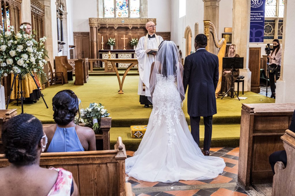 bride and groom saying vowels london wedding photographer