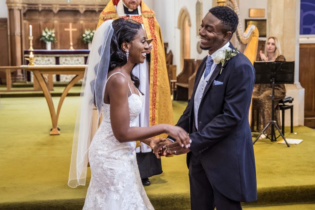 bride and groom kiss in church, london wedding photographer