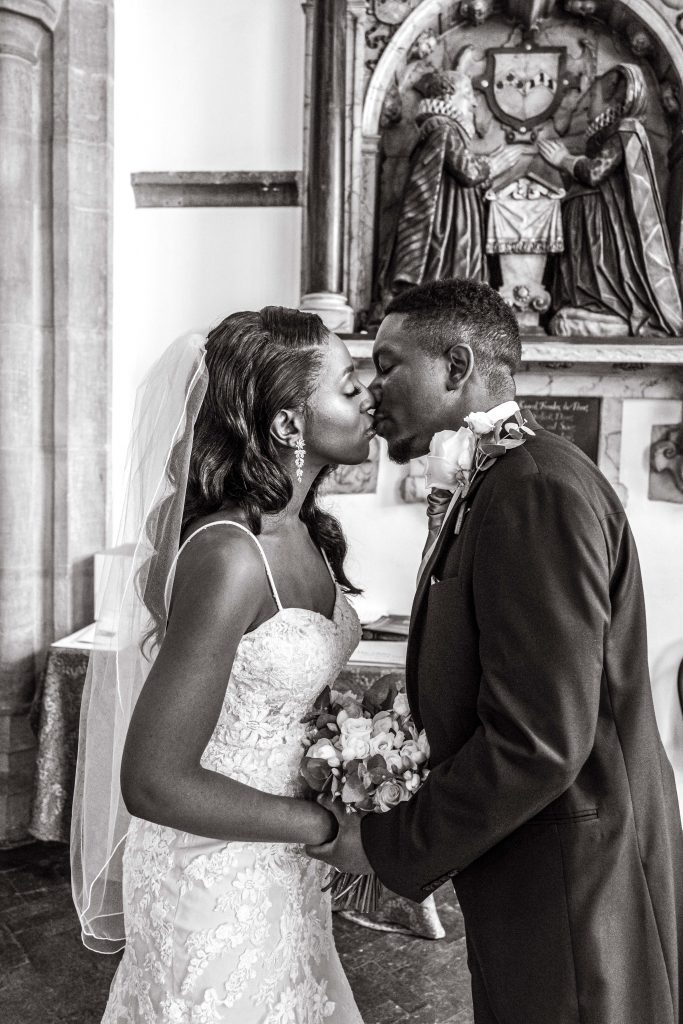 bride and groom kiss, finchley church, london wedding photographer