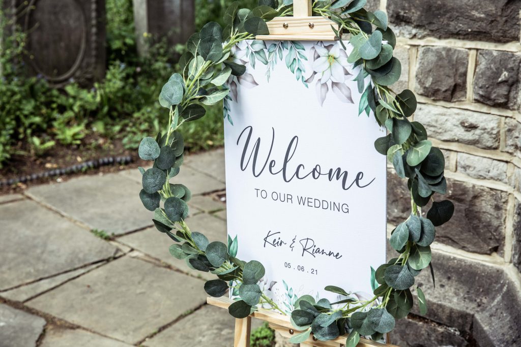welcome sign outside church wedding