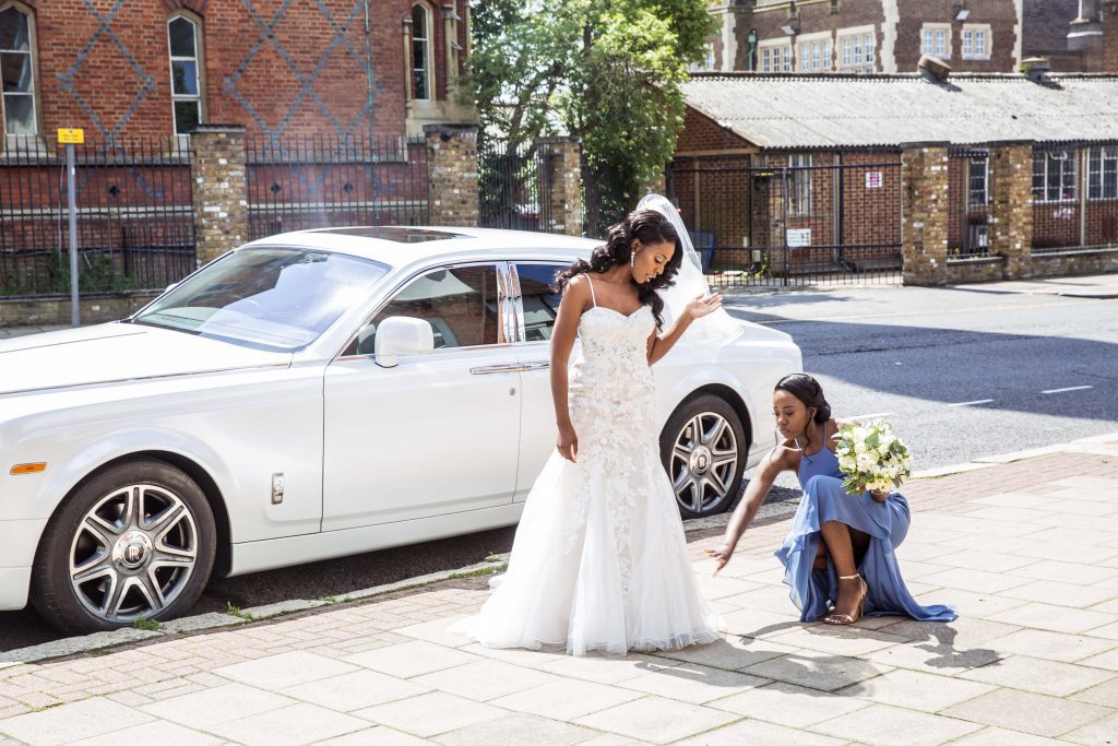 bride outside church, wedding car, london wedding photographer