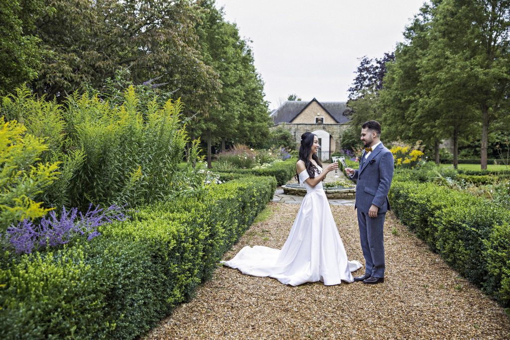 bride and groom in gardens Hanbury Manor , wedding photography