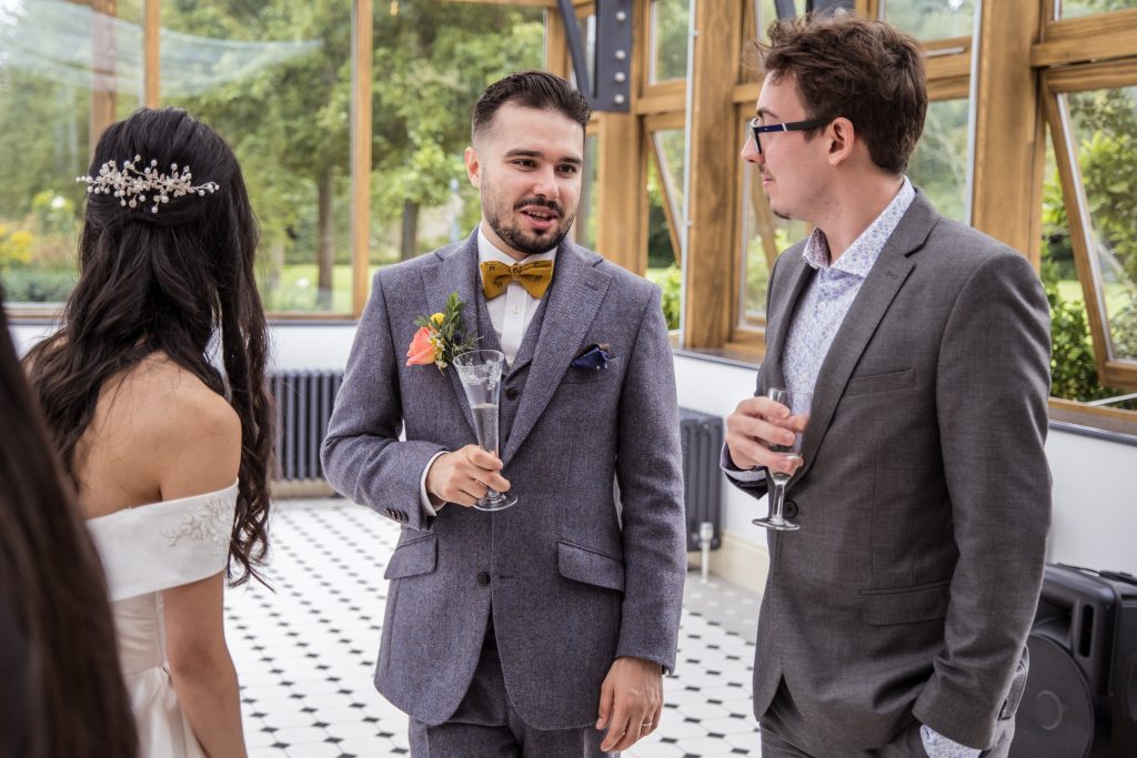 Groom in suit Hanbury Manor