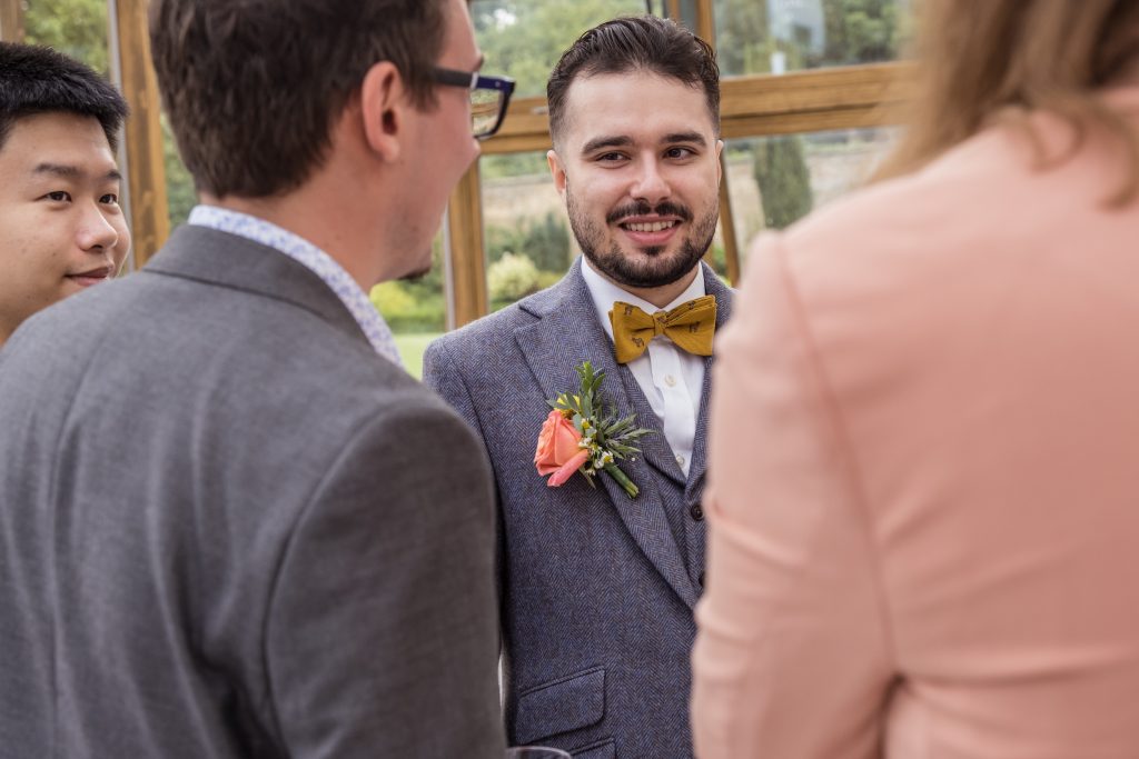 Groom smiling Hanbury manor