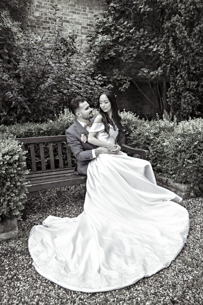 bride and groom in gardens Hanbury Manor , wedding photography