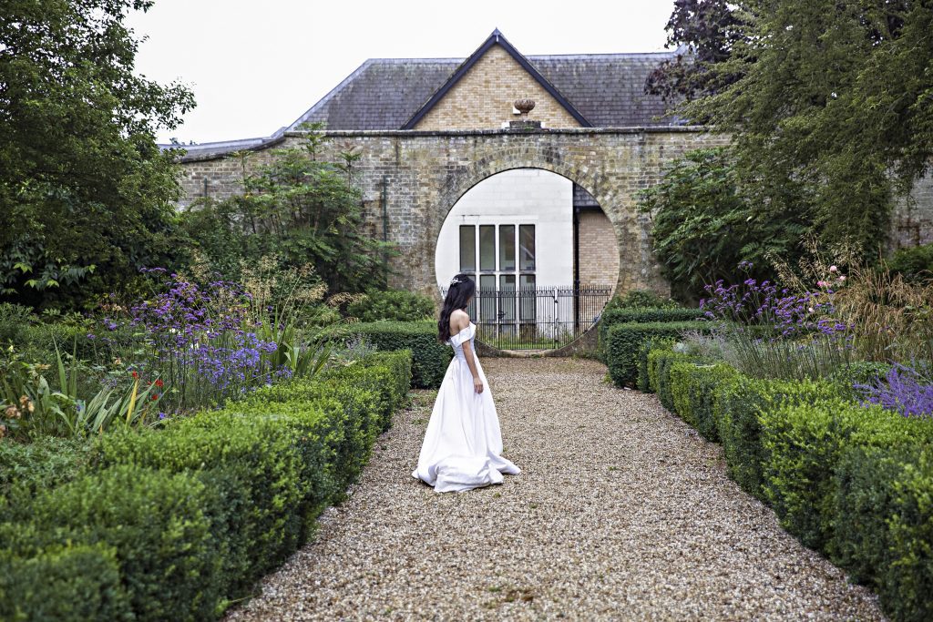 bride in gardens Hanbury Manor , wedding photography