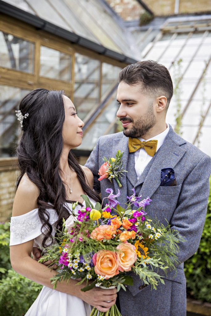 bride and groom in gardens Hanbury Manor , wedding photography