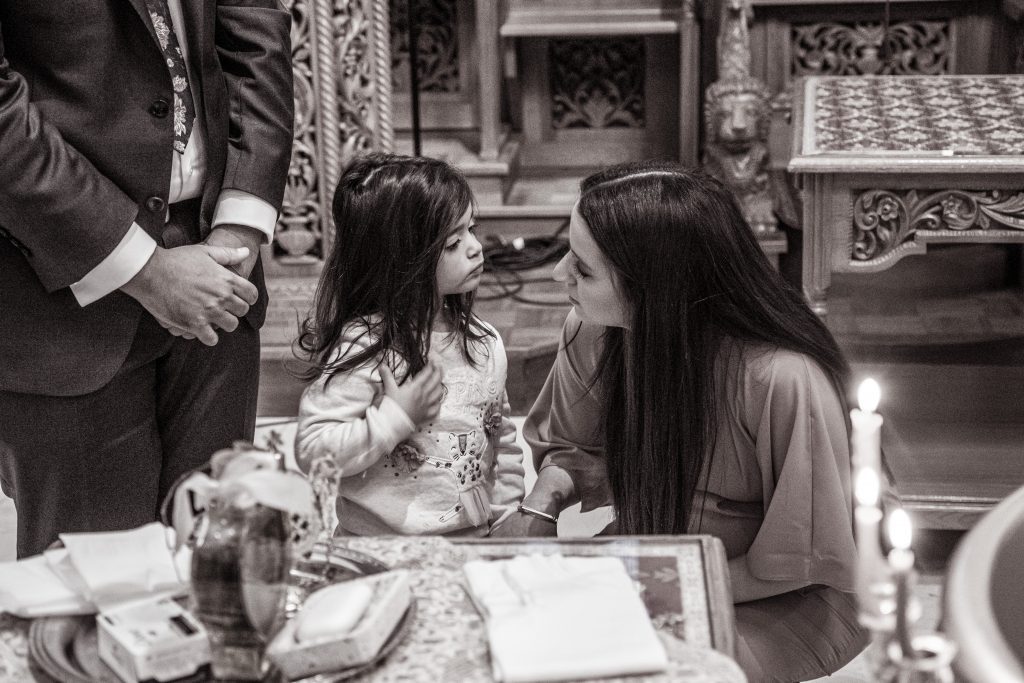 auntie and niece at greek christening 