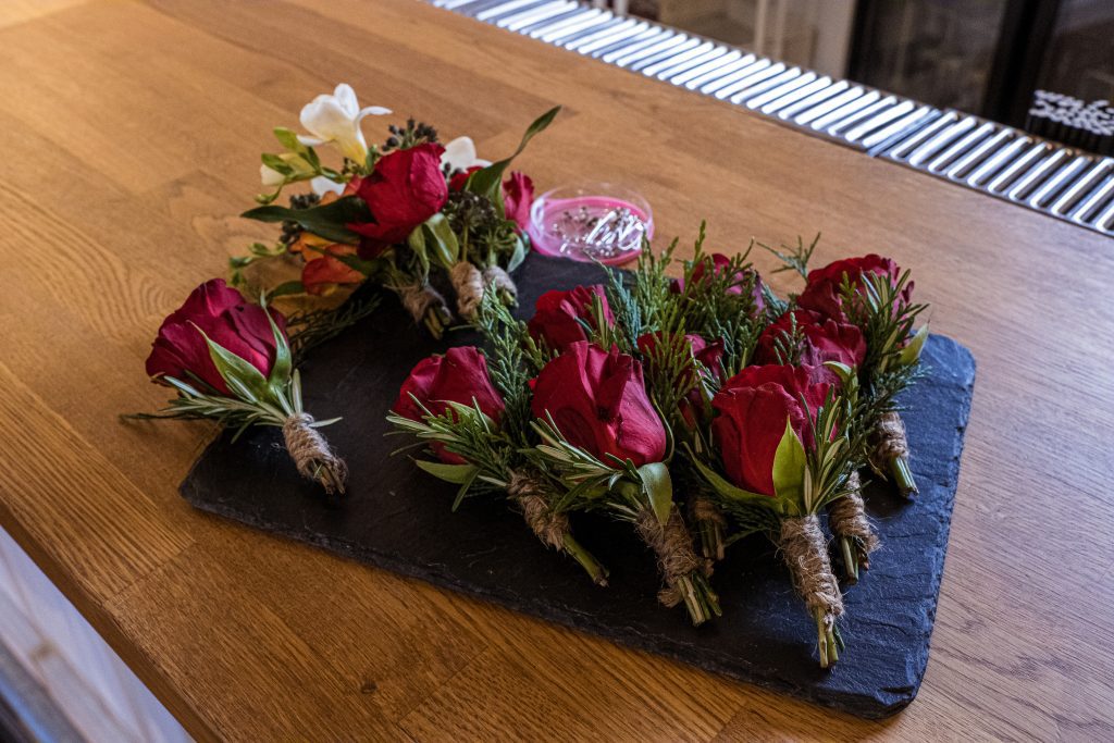 red rose buttonholes, the barns at Alswick, wedding photographer