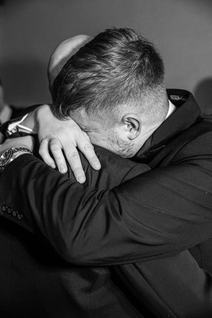 brother hugs groom crying, the barns at Alswick