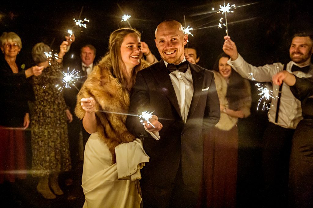 bride and groom with sparklers, the barns at alswick