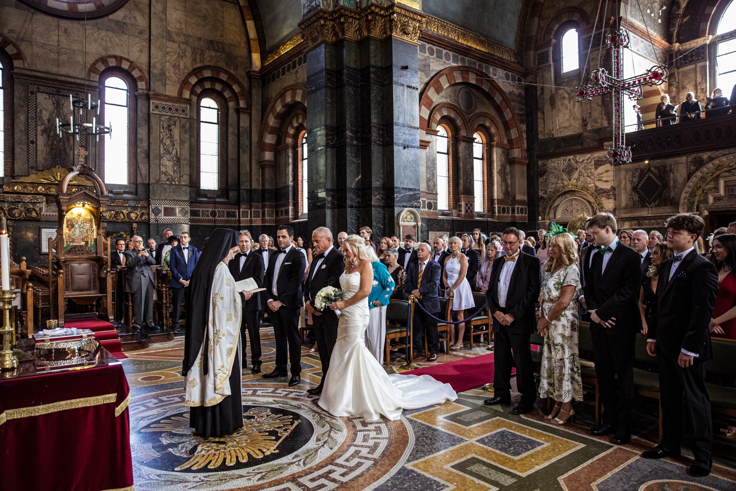The wedding congregation at the St Sophia greek orthodox church in Moscow Road, London