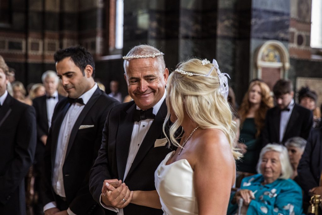 Groom smile at bride at St Sophia greek wedding in Moscow Road, London