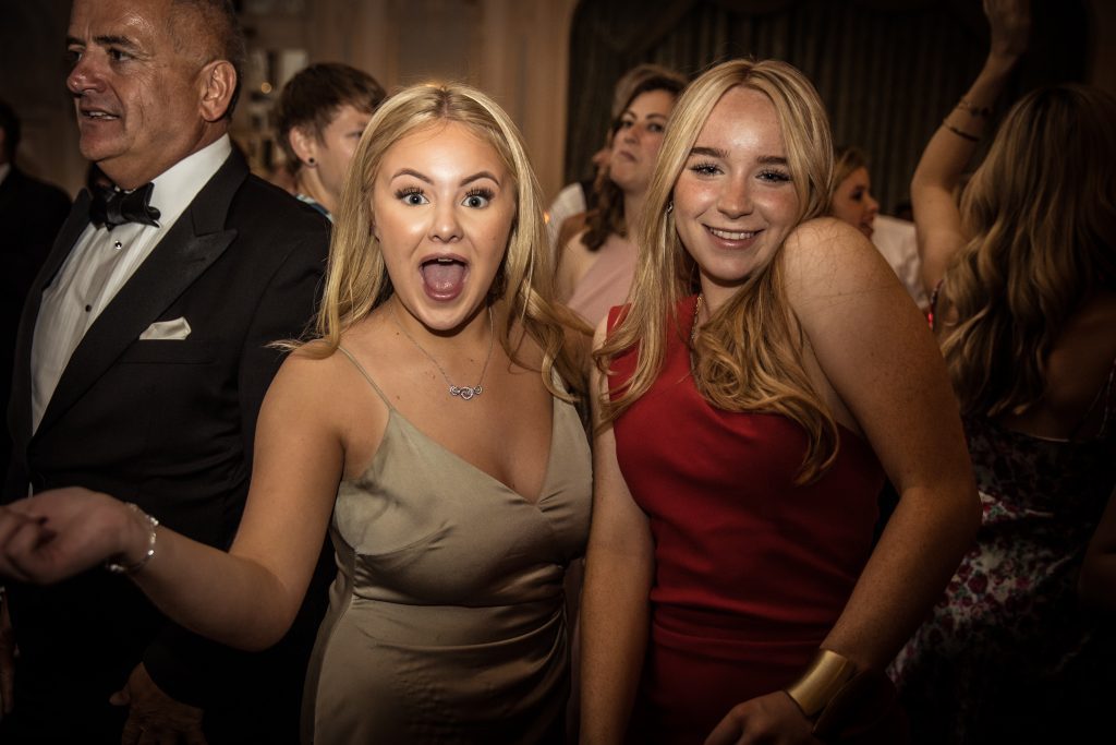 wedding guests pose for photographer at The Savoy in London