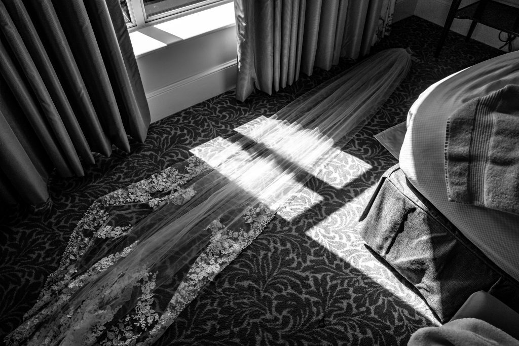 A lace wedding veil on floor of a suite at The savoy