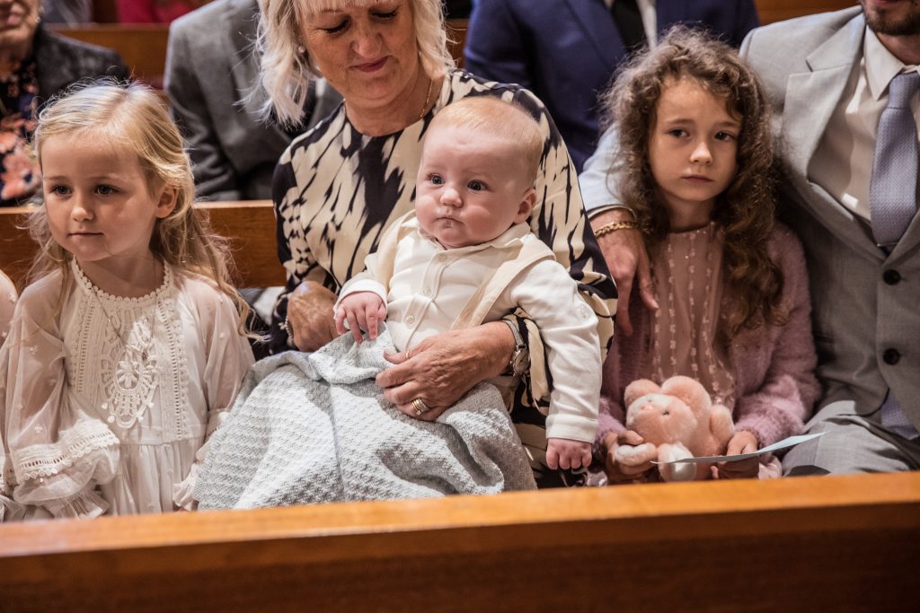 a baby watches parents get married
