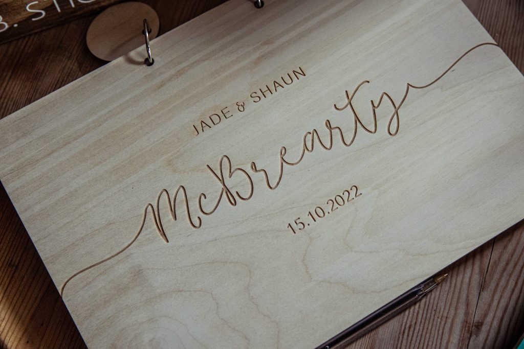 wedding guest book engraved with names