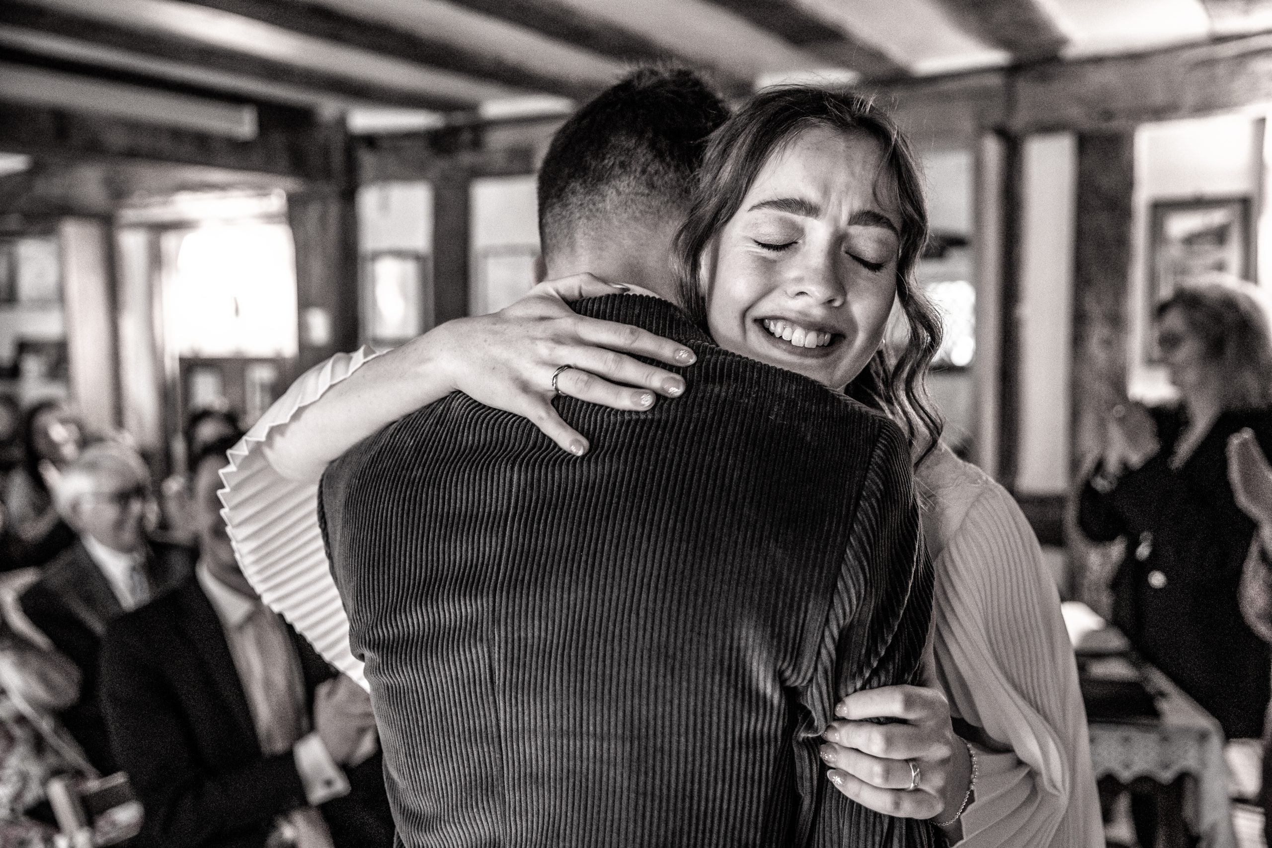 the bride and groom embrace after saying 'I Do'