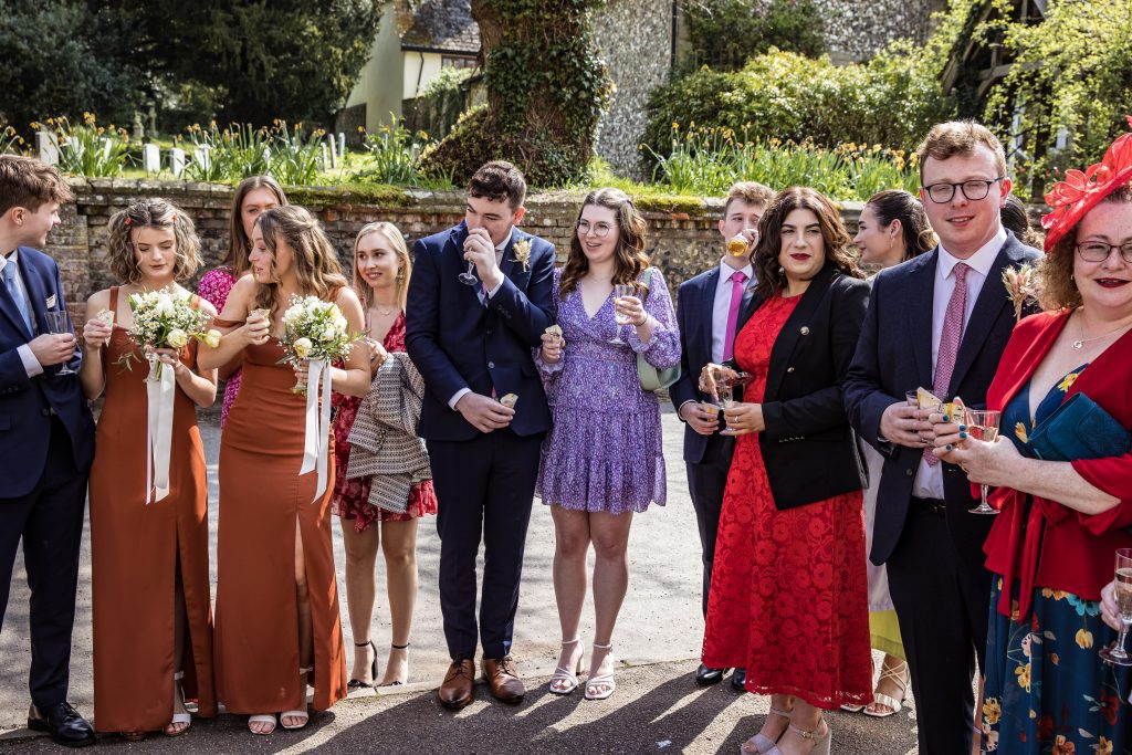 guests wait to throw confetti at The Barley Townhouse in Royston