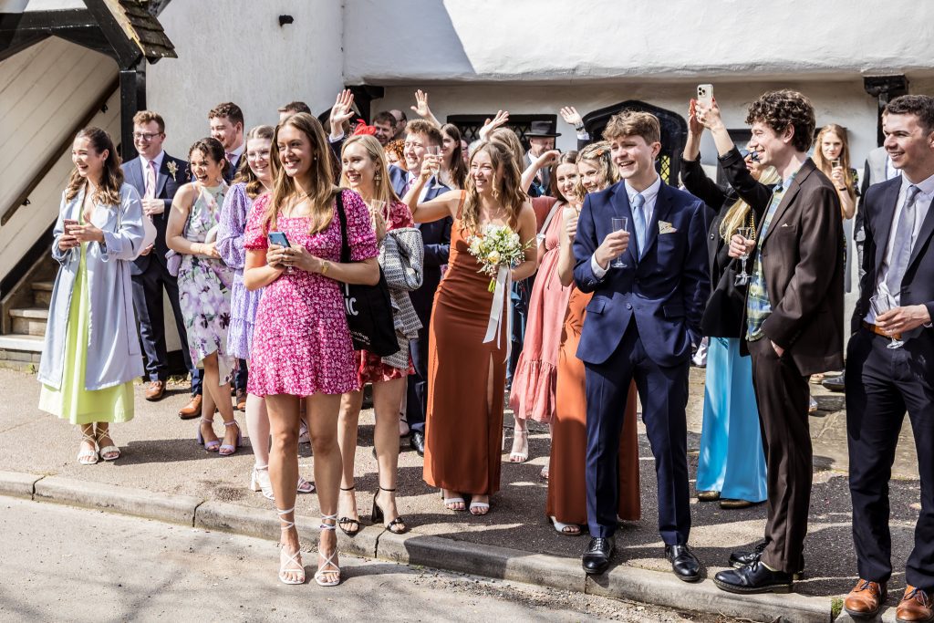 guests wave at Happy couple out side The Barley Townhouse