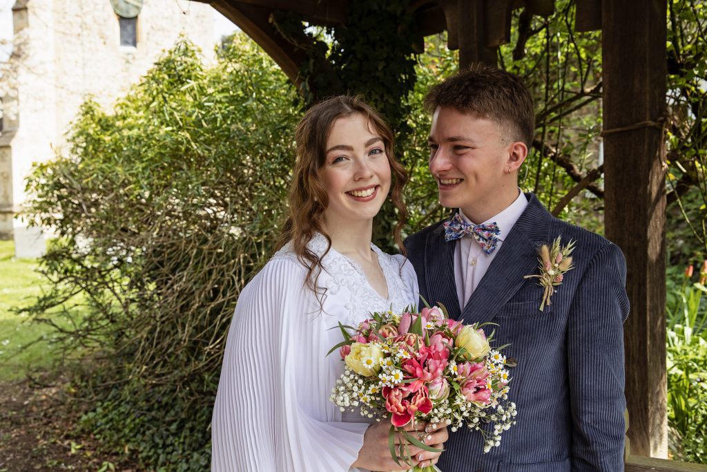 bride and groom outside church in Royston Hertfordshire wedding