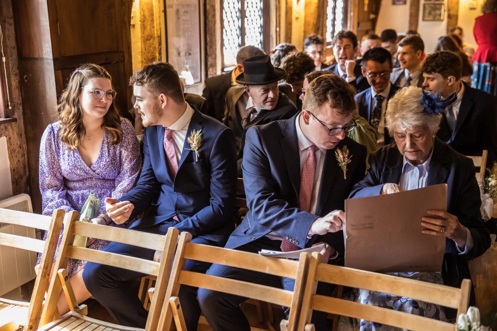 guests wait for the bride at The Barley Townhouse in Royston