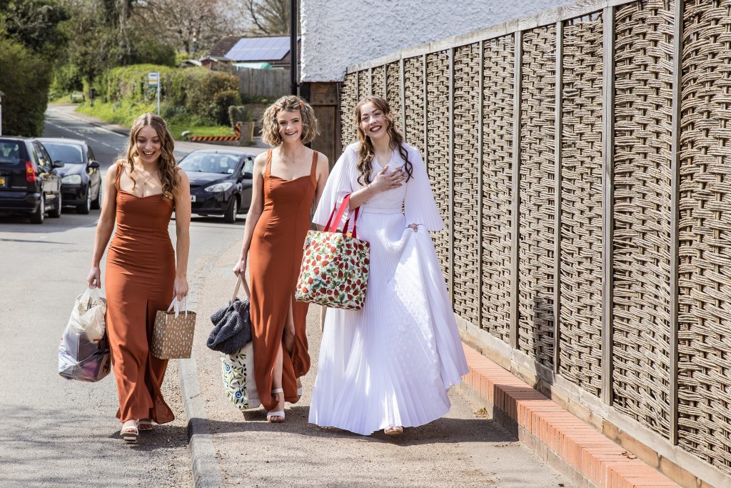 a bride and her bridesmaids arrive at the wedding at The Barley Townhouse in Royston