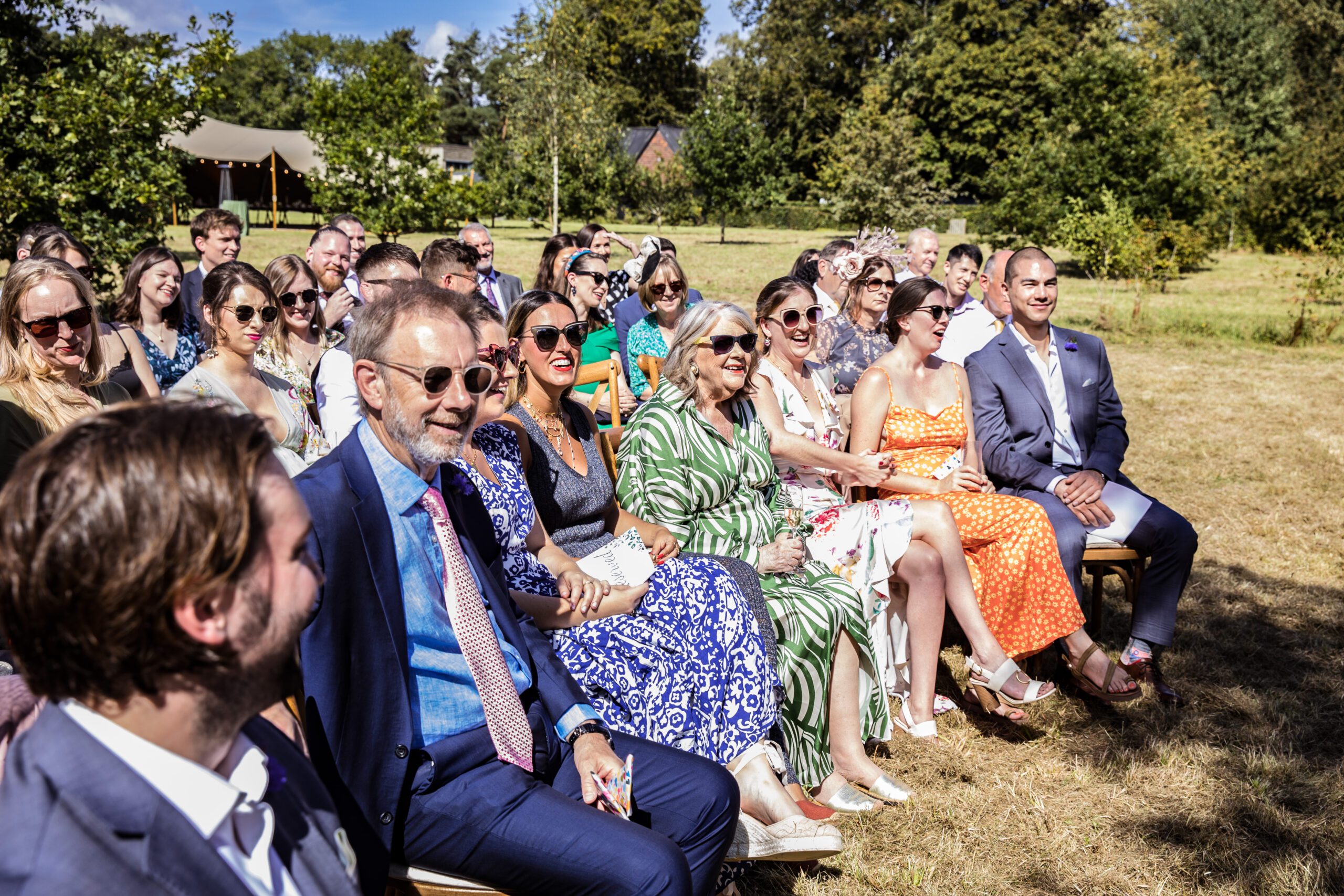 the happy wedding guests at a hertfordshire garden wedding