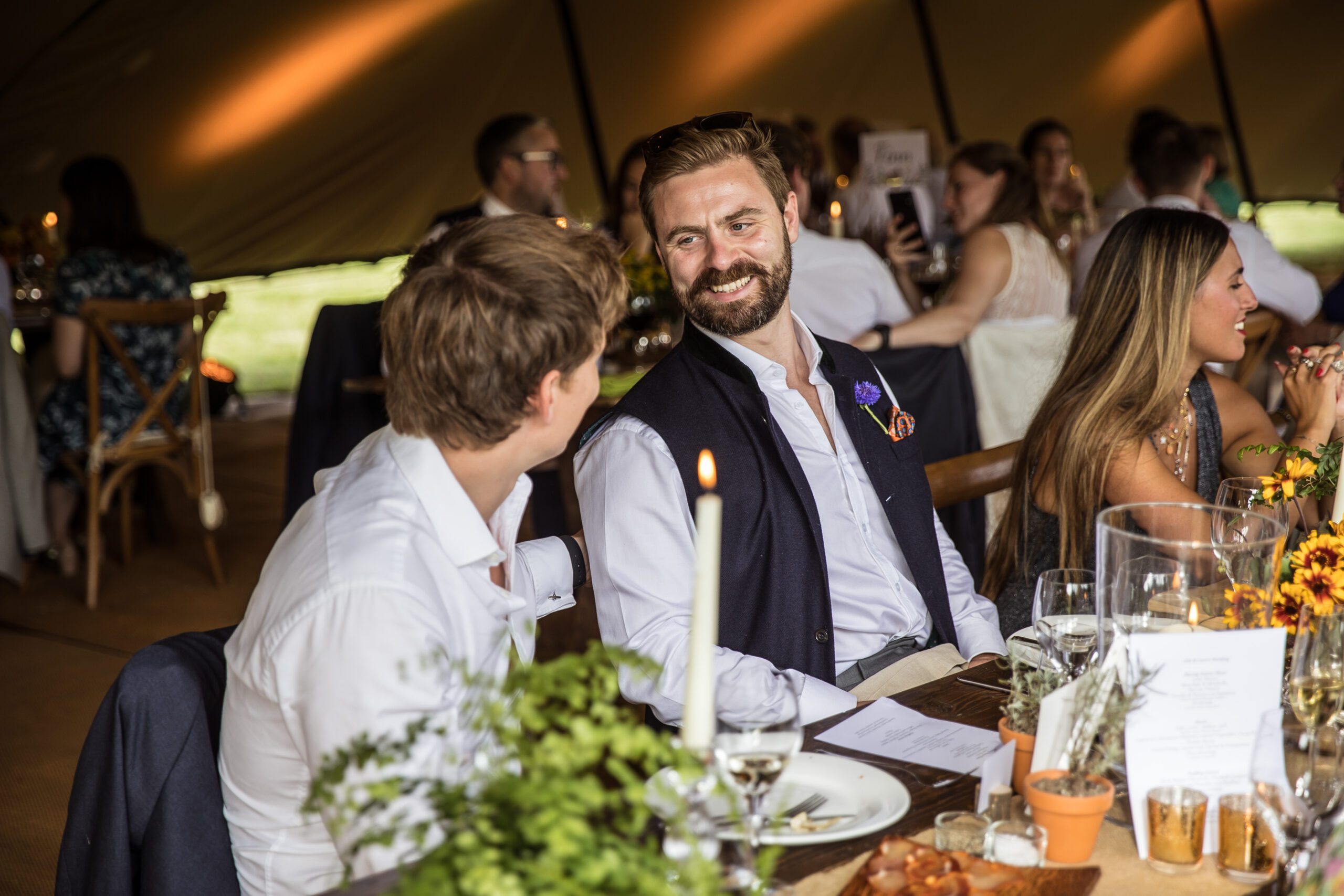 guests smile at a hertfordshire garden wedding