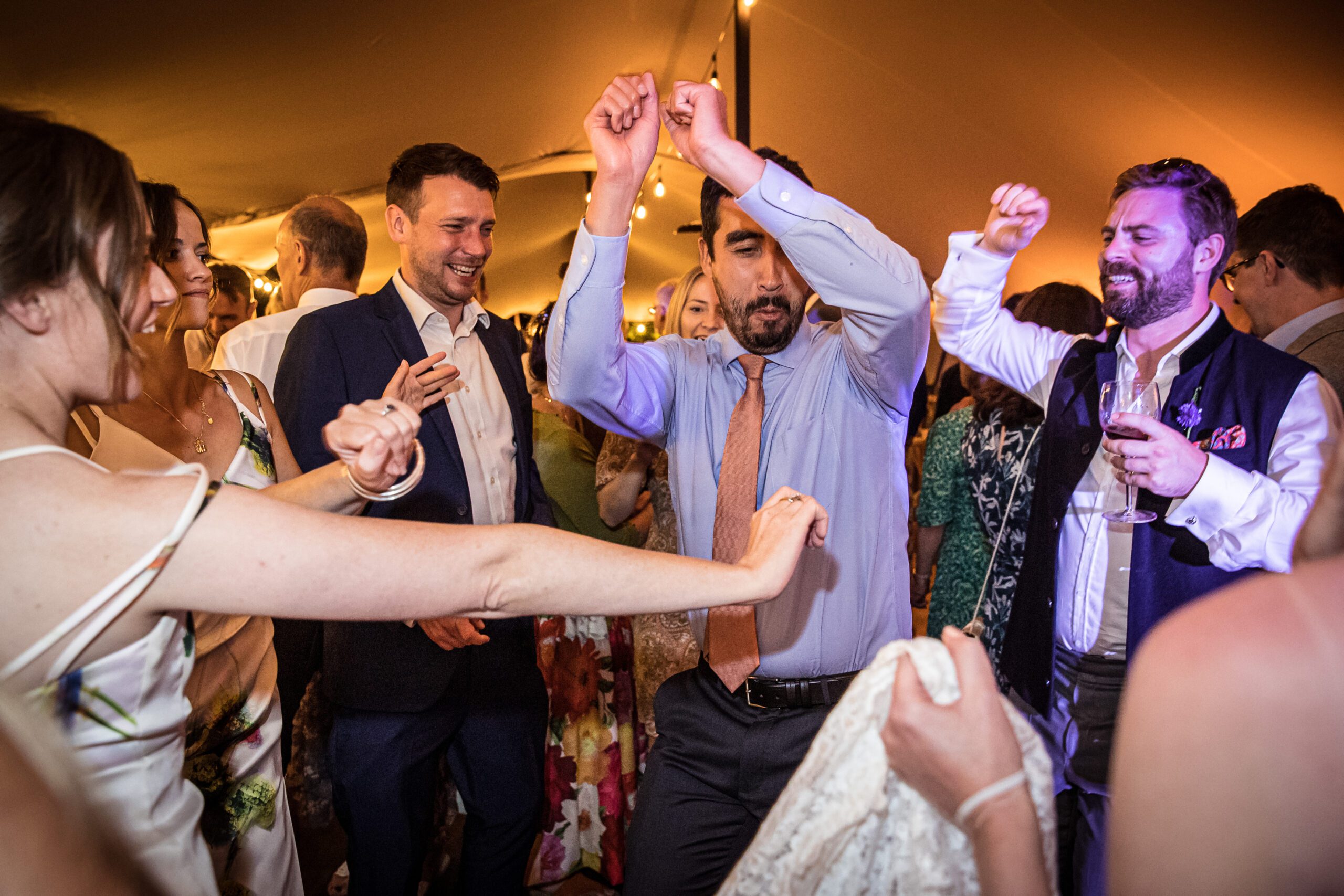 the guests dance merrily at hertfordshire garden wedding