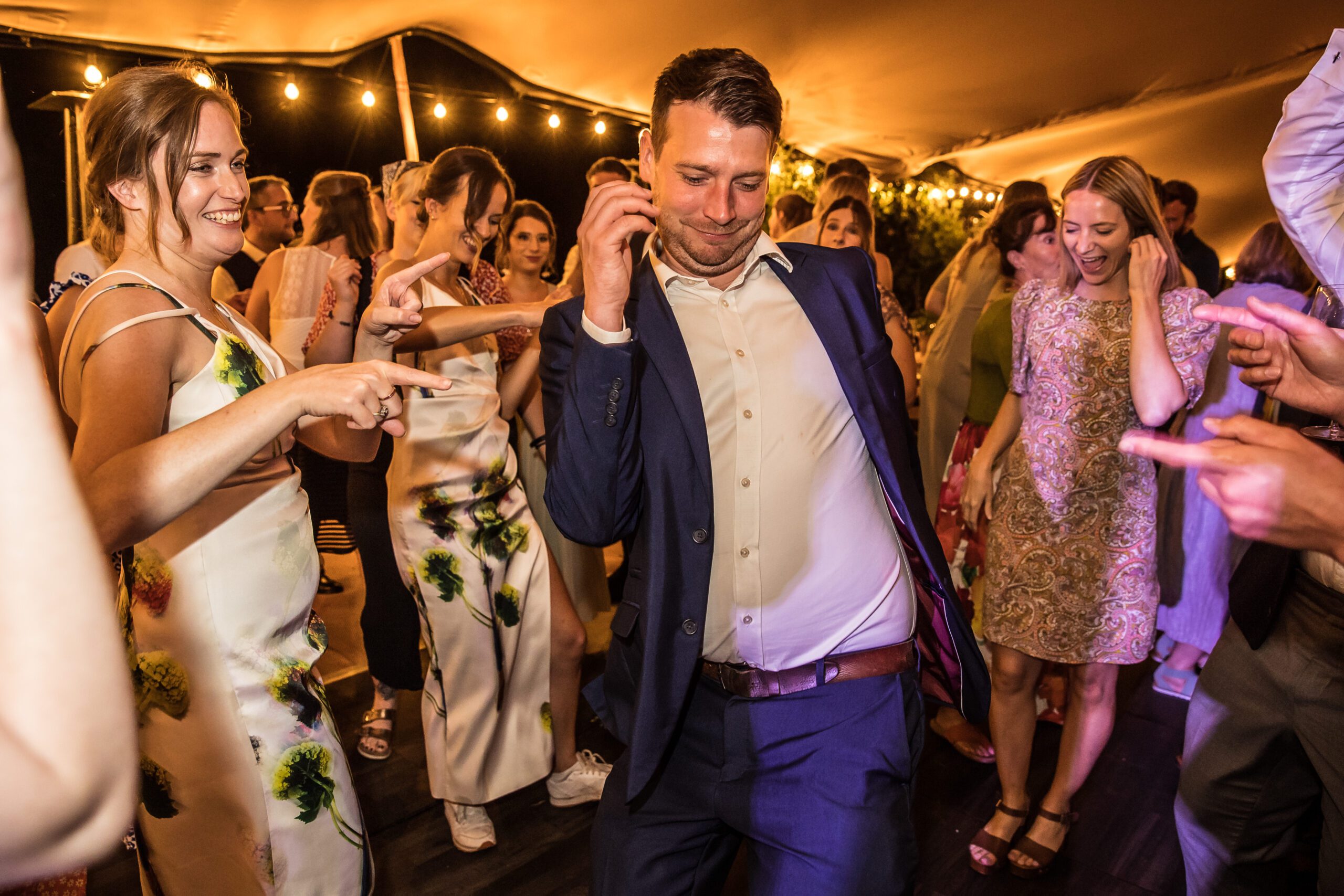 the guests dance merrily at hertfordshire garden wedding