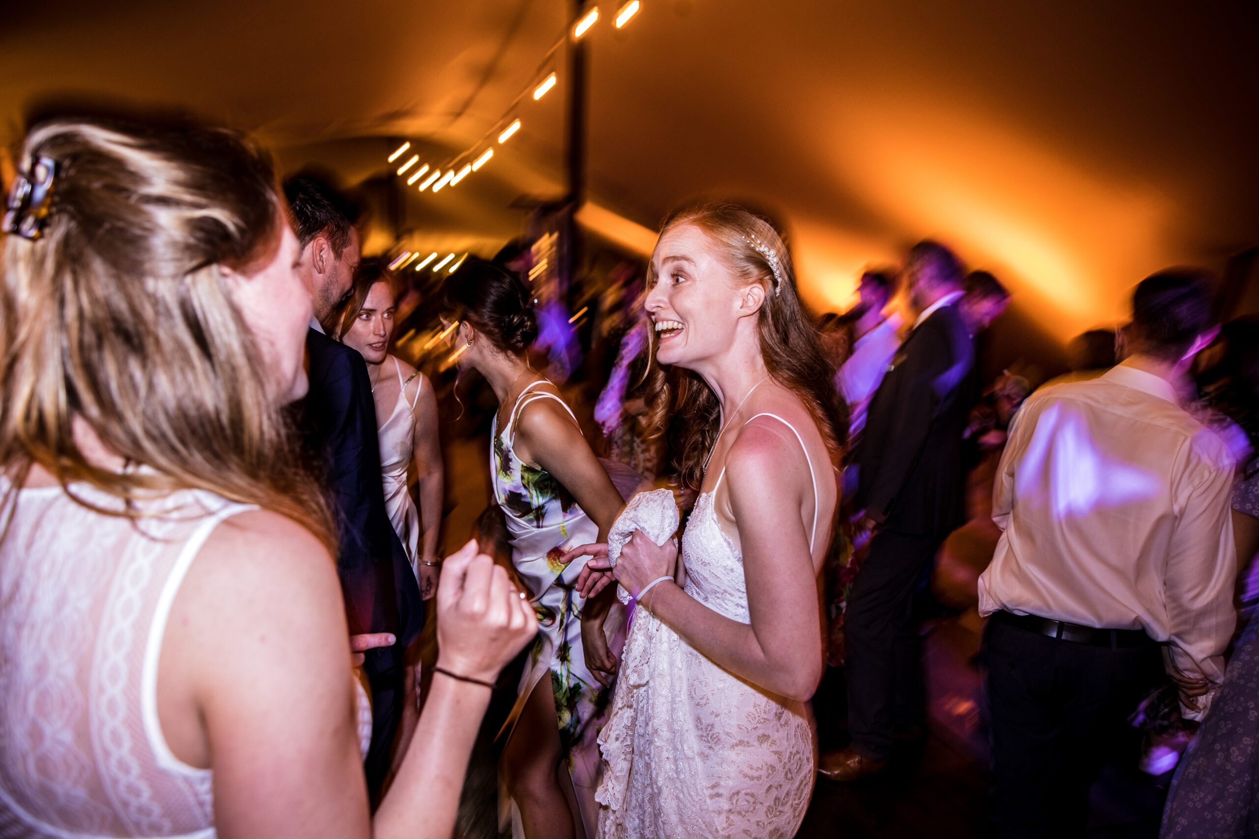 the guests dance merrily at hertfordshire garden wedding