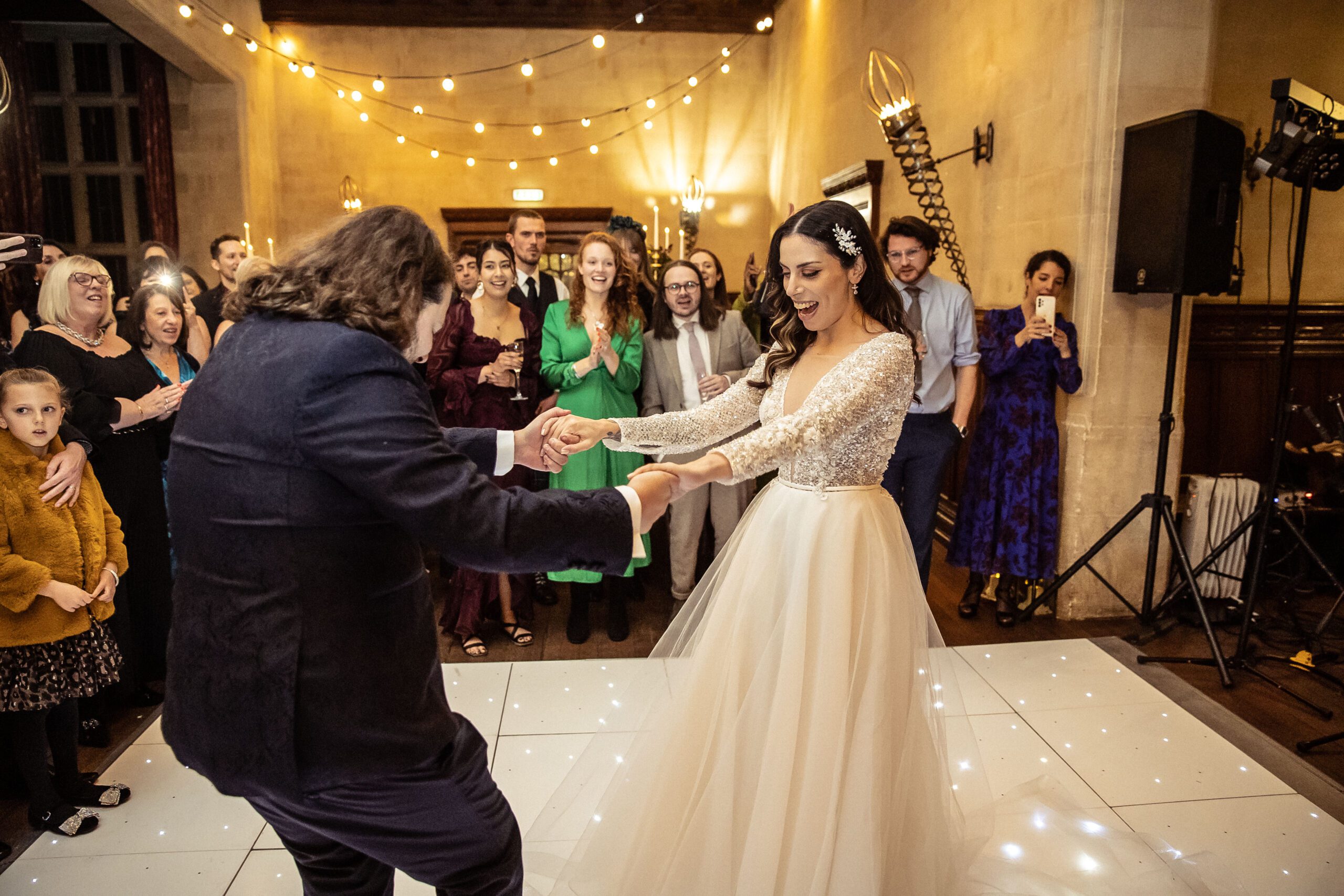 A bride and groom perform their first dance at their wedding at Fanhams Hall.